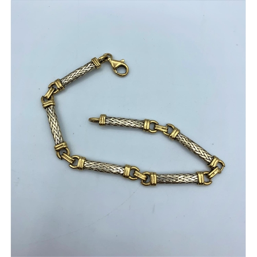 253 - (Withdraw) A 9ct yellow and white Gold linked woven Bracelet, weight 9g and 19cm approx