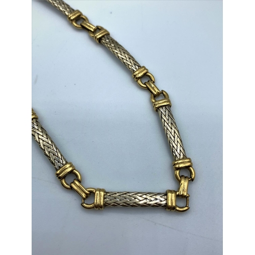 253 - (Withdraw) A 9ct yellow and white Gold linked woven Bracelet, weight 9g and 19cm approx