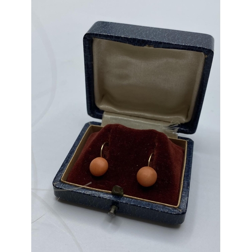 18 - A 19th Century pair of 18ct gold earrings with natural (untreated) pink coral in original presentati... 