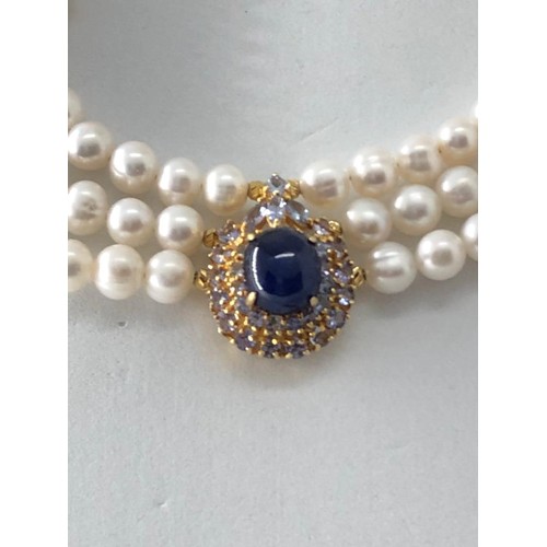 249 - Pearl triple row necklace with Rubies and Sapphires, Thai Cabochon Sapphire 9x11x8mm centre stone ,s... 