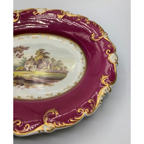 123 - Daniel shell border shape oval serving dish in maroon, some age related marks.