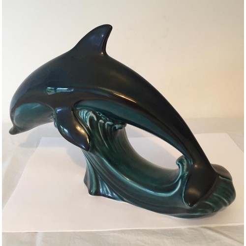 392 - Diving Dolphin from the Poole Pottery, deep blue colour with a clear 'Poole' stamp on the underside,... 