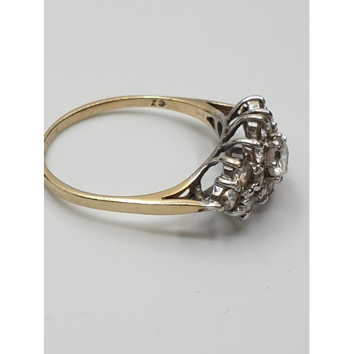 383 - Stone set 9ct Gold Cluster Ring, having a large centre clear stone  with a 14 Zirconia surround, siz... 