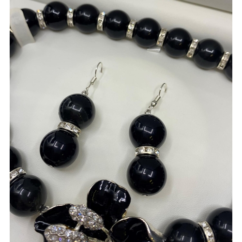 405 - A Mexican Obsidian Choker Necklace and matching Earrings set in a presentation box.