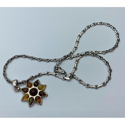 418 - Scandinavian Silver and Amber Pendant and Chain, the pendant having nine stones in various shades of... 