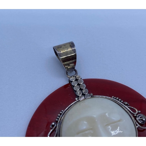 48 - Rare unusual Silver and Carnelian Pendant Having Cream Coloured Face to Front. 4cm in Diameter.