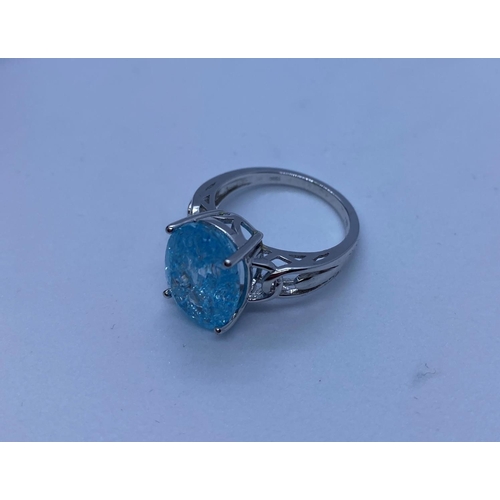 68 - Stone Set Silver Ring Having a Large Oval Sparkling Topaz Coloured Stone in Claw Mount. Design Pierc... 