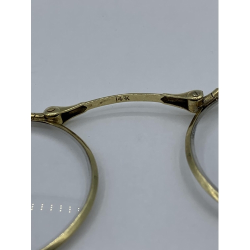 360 - Vintage Lorgnette folding Glasses set in 14ct Gold frame.