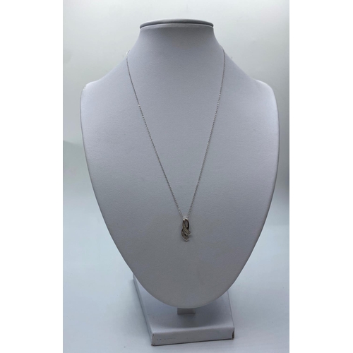 264 - 9ct Diamond Pendant & Chain, 1.2g, 44cms.