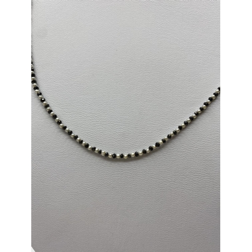 276 - Black Diamond and Pearl Necklace, 3.2g, 44cms.