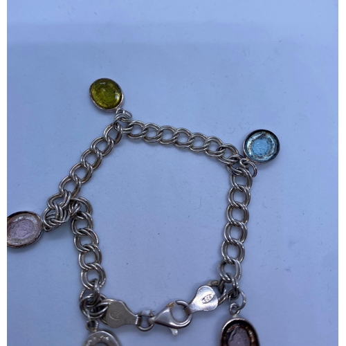 409 - Unusual Silver Charm Bracelet with small Cameo charms, weight 11g and 16cm long approx.