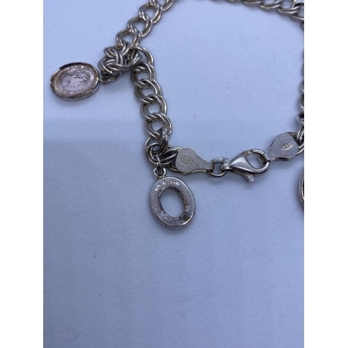 409 - Unusual Silver Charm Bracelet with small Cameo charms, weight 11g and 16cm long approx.