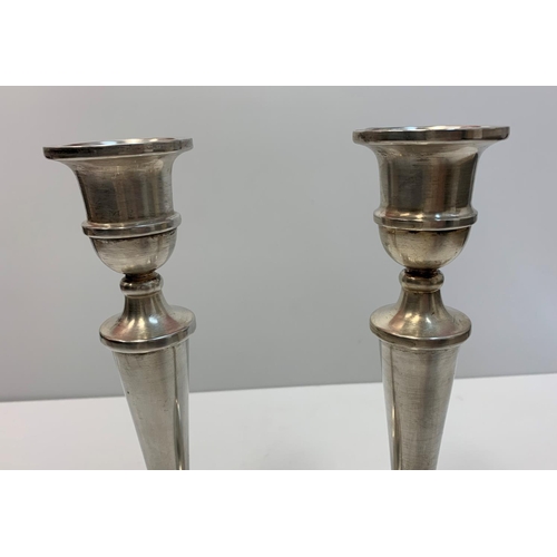 187 - A pair of silver tapered candle sticks, both 25cms tall and 854g.