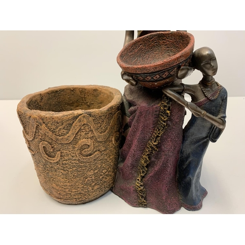 189 - Unusual African sculpture of 2 women and their cooking pots, made from clay with metallic finish. 30... 