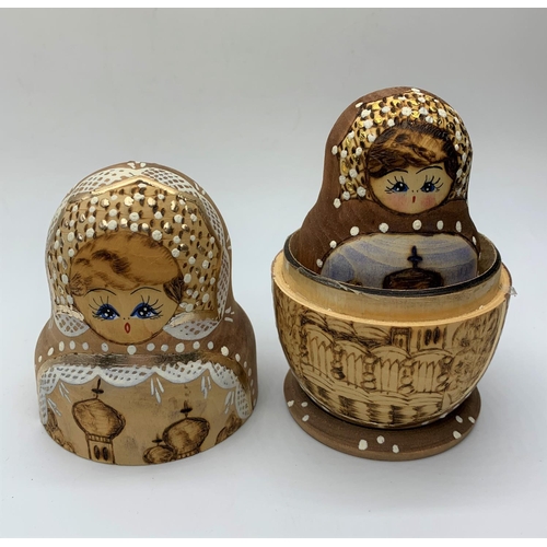 195 - Handmade wooden Russian doll, containing a further 4 dolls inside , 13cm tall