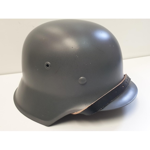 11 - WW2 Style German M42 Re-enactors steel helmet.  Marked et.64 (replica)