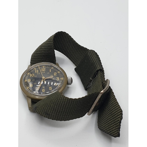 87 - Vietnam Made US Army Plastic Manual Wrist Watch. Dated 1969.