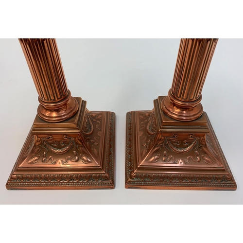 521 - A Pair of Antique Copper Corinthian Column Candlesticks, 32cm tall and 2kg weight (2)