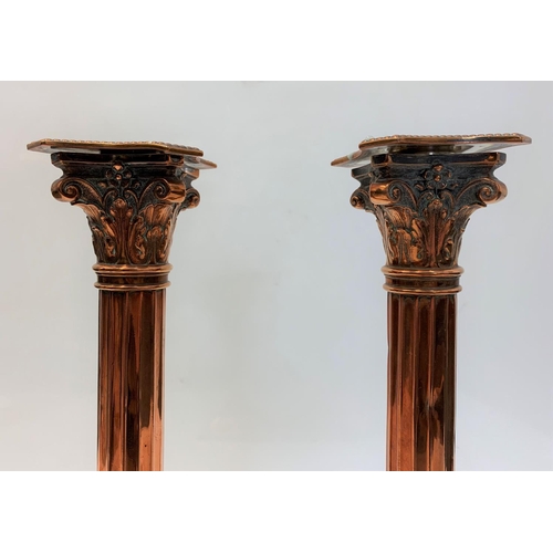 521 - A Pair of Antique Copper Corinthian Column Candlesticks, 32cm tall and 2kg weight (2)