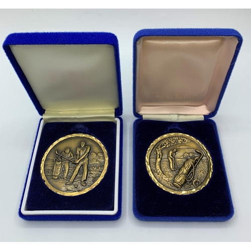 524 - 2x 1980's Golf Awards, 6cm diameter in velvet presentation boxes (2)