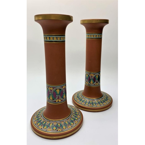 529 - Pair of Terracotta Candlesticks, 18cm tall and 1kg weight with Byzantine design decoration (2).