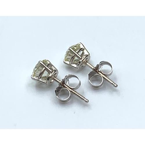 486 - Pair of 18 ct Diamond Stud Earrings with over 1 carat of diamonds set in white gold.