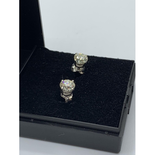 488 - Pair of Diamond stud earrings with 1.46ct diamond