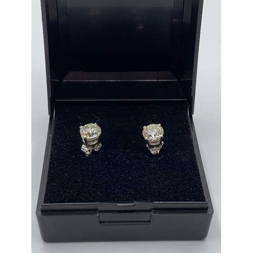 488 - Pair of Diamond stud earrings with 1.46ct diamond