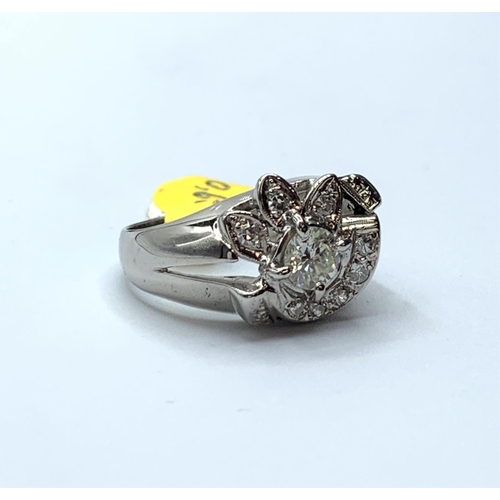 490 - 14ct white gold diamond ring with petal design, 0.80ct diamond in total, weight 6.1g and size N