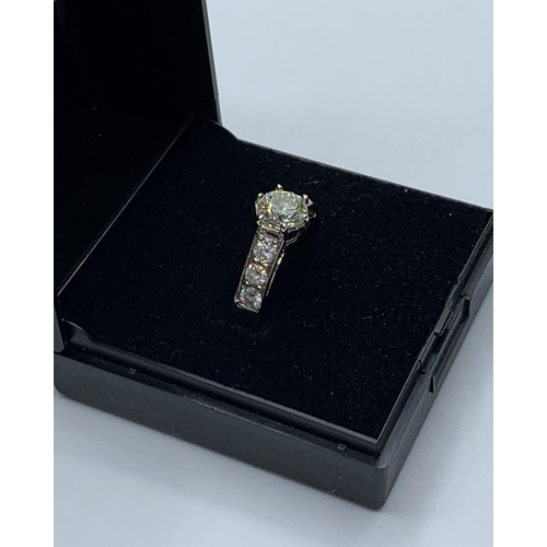 494 - 1.01ct diamond set in 14ct gold with 0.50ct diamond shoulders, weight 4.3g and size M