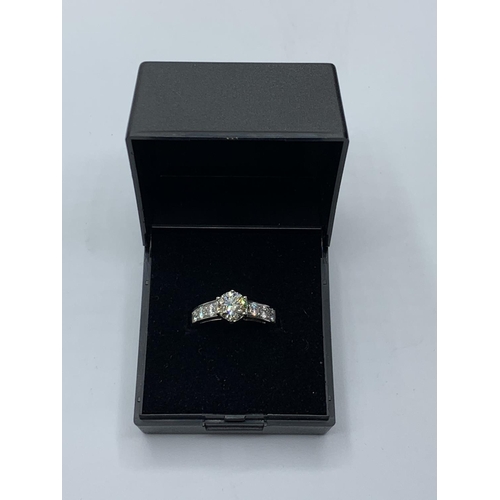 494 - 1.01ct diamond set in 14ct gold with 0.50ct diamond shoulders, weight 4.3g and size M