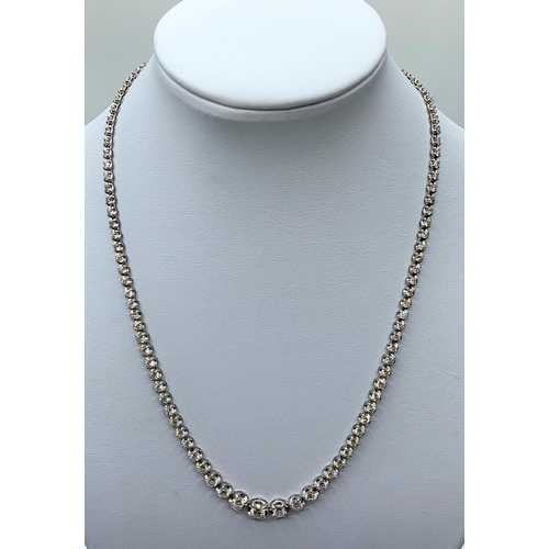 506 - 18ct white gold necklace with 10ct of graduated stones, weight 16.73g and 42cm long