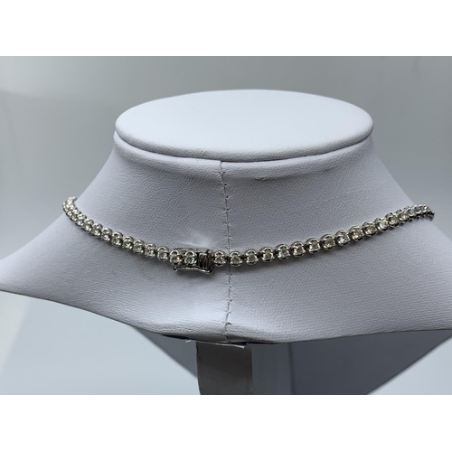 506 - 18ct white gold necklace with 10ct of graduated stones, weight 16.73g and 42cm long