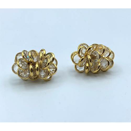 556 - A Pair Of 18ct Gold and Crystal Cluster Earrings in elegant shape, weight 13.5g.