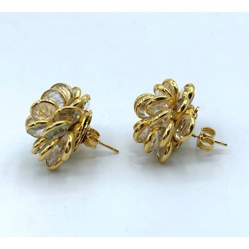 556 - A Pair Of 18ct Gold and Crystal Cluster Earrings in elegant shape, weight 13.5g.