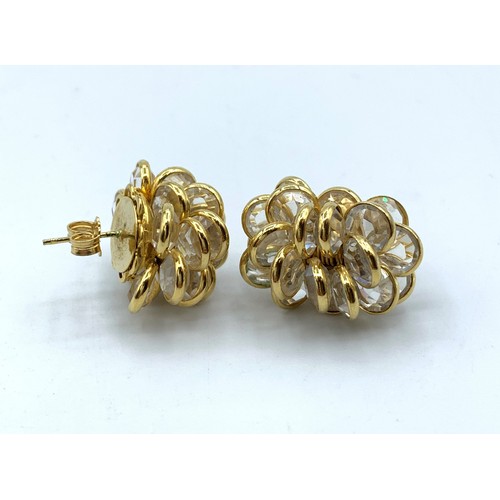 556 - A Pair Of 18ct Gold and Crystal Cluster Earrings in elegant shape, weight 13.5g.