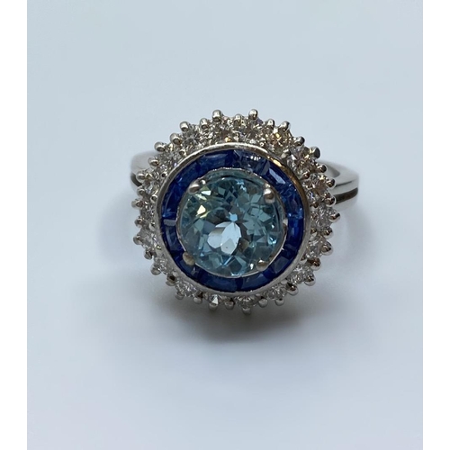 278 - 18ct White Gold Ring with Aqua Marine Centre Stone Surrounded by Sapphires and Diamonds, 6.8g, Size ... 