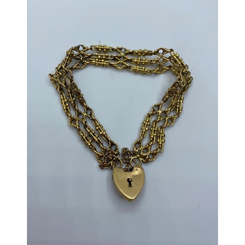 558 - 9ct Gold Watch Chain transformed into a Bracelet with Heart padlock, weight 28.7g and 16cm long appr... 