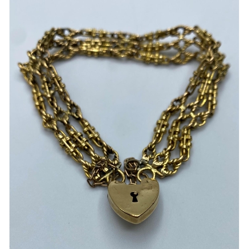 558 - 9ct Gold Watch Chain transformed into a Bracelet with Heart padlock, weight 28.7g and 16cm long appr... 