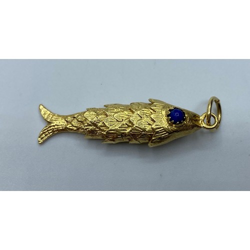 551 - 18ct gold articulated Fish Pendant, weight 6.8g and 4cm long approx.