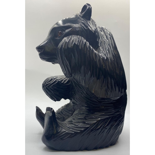 569 - Carved wooden black bear, 22cm tall and 1kg approx