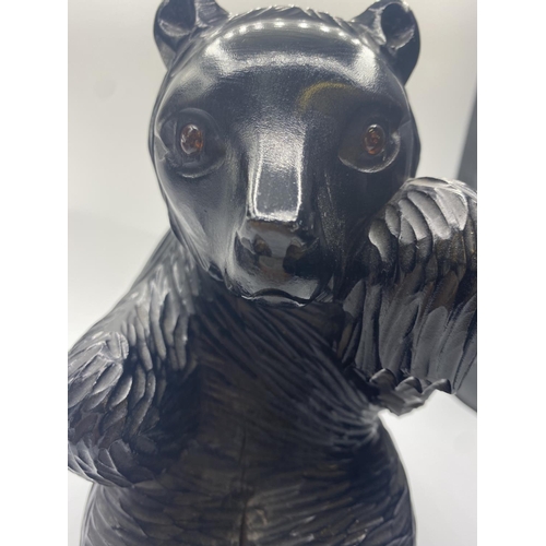 569 - Carved wooden black bear, 22cm tall and 1kg approx