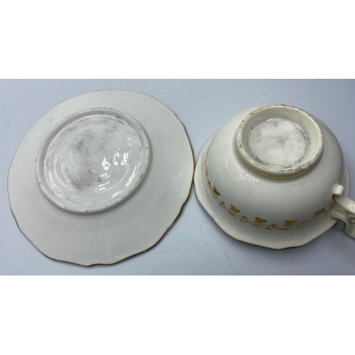 577 - H&R Daniel second  gadroon shaped cup & saucer with unusual dragon decoration some fading to lustre ... 