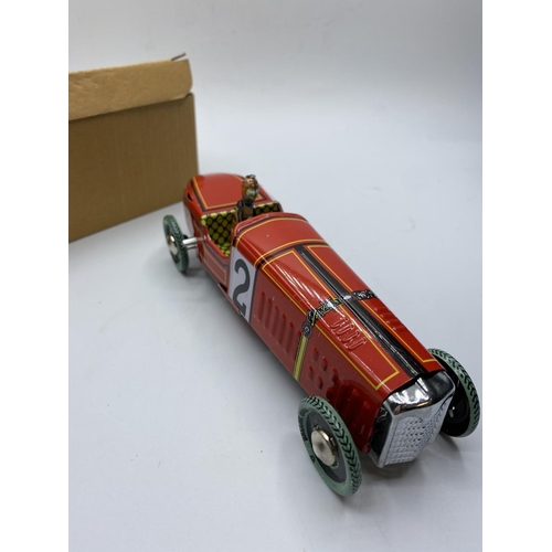 597 - Clockwork Tin Racing car with key