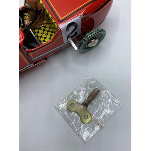 597 - Clockwork Tin Racing car with key