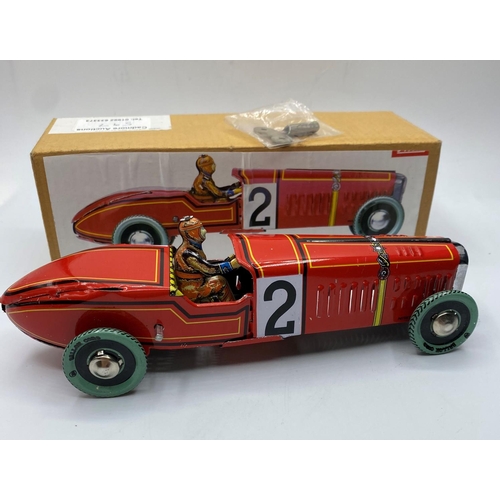 597 - Clockwork Tin Racing car with key