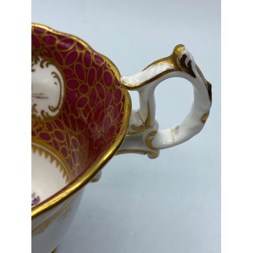 605 - H&R Daniel shell shape cup & saucer, repair on handle and chip on rim