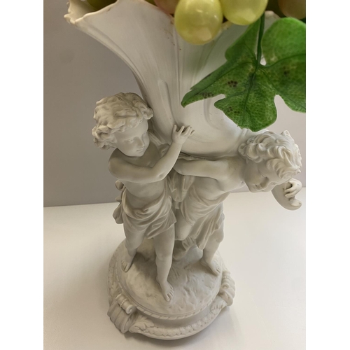 617 - Large Ceramic statue of 2 cherubs holding the horn of plenty 32cm tall and weight 2.6kg.