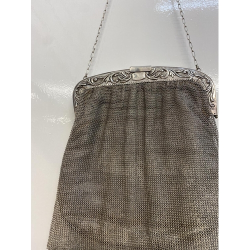 9 - Silver Art deco evening bag having wide silver band to top with scrolled floral work, secure opening... 