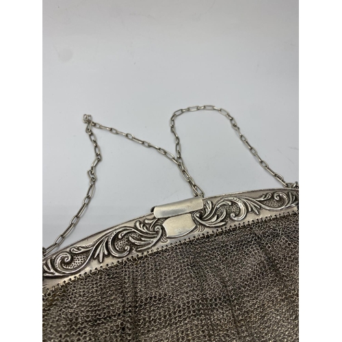 9 - Silver Art deco evening bag having wide silver band to top with scrolled floral work, secure opening... 